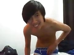 Impressive cock of an Asian boy gets jerked well