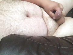 Uncut Bear Naked on the couch cumming