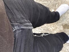 Pissing my black jeans outside