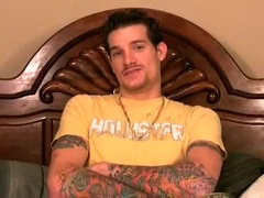 Heavily tattooed guy tops ass