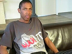 UK black twink Bobby cums hard after stroking his massive cock