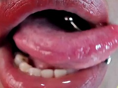 Tongue pierced ebony fetish tease spit close up