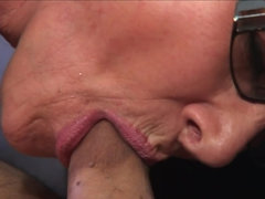 The lovely milf with glasses is teasing her pussy in front of us