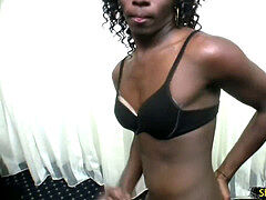 Dark flesh she-male masturbates her huge ebony shecock