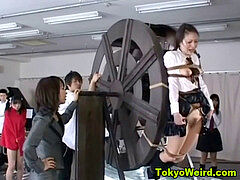 japanese schoolgirls punished on waterwheel