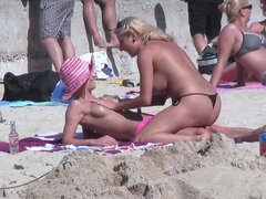 Blonde Lesbians' Public Beach Striptease Ignites Desire