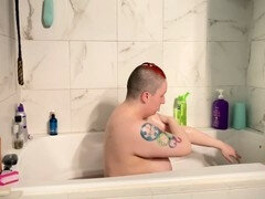 Soapy redhead babe gets wet and dirty in the bathtub