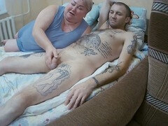 Hot MILF jerks cock, gets face covered in cum, and swallows sperm