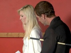 Dominant Master Priece uses a cane to dominate submissive blonde Kelly in the dungeon