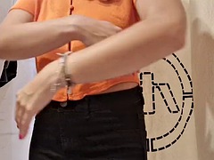 The curtain in the fitting room is open, I flash my tits