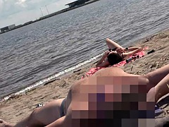DICK FLASH ON BEACH - Small cock flashing in public