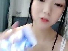 Horny asian amateur teen in mask toying on webcam