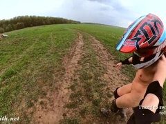 Naked woman riding a Dirt Bike