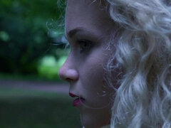 Beauty Blonde reads a book outdoor