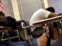Candid feet flip flops on chair
