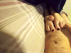 Lazy Footjob with jism on toes