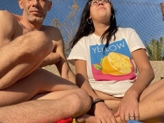 I seduce a voyeur on the beach, he pleasures my pussy and I give him a handjob