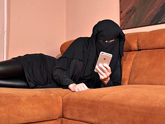 Black niqab and big black dildo