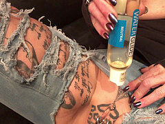 KinkyFrida in denim plays with her pierced and tatted beaver