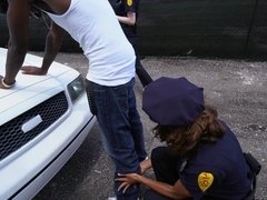 Female police officers having a 3some with a bbc over their patrol car