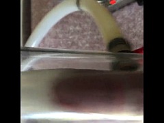 Milking machine sucks big dick while standing