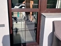 A stranger looks at a naked woman from the balcony in a hotel, she is masturbating, she comes out to him and helps him