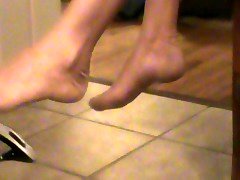 dangling heels off of  stockingb feet