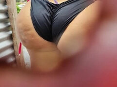 Amateur Latina in public beach dressing room caught on camera with a big butt