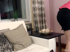 Alessia strips naked on couch and masturbates
