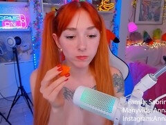 Kinky redhead girl enjoys some carrot snacks in an ASMR style