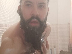Inked and hairy otter jerks off in the shower