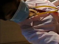 Beautiful Female Surgeon With Surgical Gloves Fisting