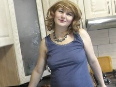 Sexy platinum-blonde milf in a shirt, no panties or bra, rocks the kitchen while giving a handjob in heels and stockings