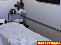 Inked asian hanjob masseuse gets fingered