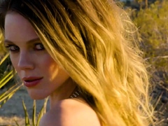 Big ass MILF strips naked in a desert