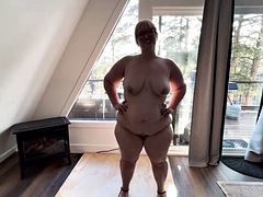 Stripping whore shows off her curves in front of the window, shaking her and shaking her boy, she orders you to cum