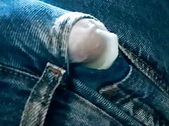 Young man ejaculating in jeans
