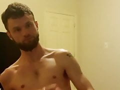 bearded beauty wanks and cums on his bed