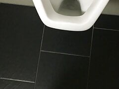 Pissing over the toilet at work