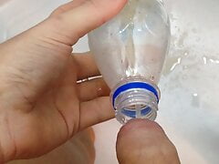 Pissing in bottle and pouring it over my cock