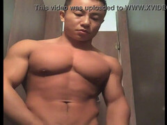 Asian muscle hunk guy shows off massive cock
