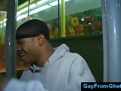 Black thug sucks white dick in public
