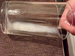 Slow motion Cumshot to glass cup