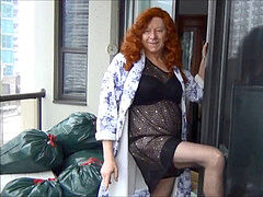 Naughty Gigi is a mischievous ginger-haired in black