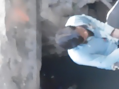spying indian man peeing near road