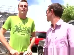 Guy drops his pants for a blowjob in a garage