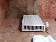 A sissy is washing herself after a group sex on a motel guest room