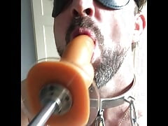Locked to fucking machine for cock sucking plus hollow glass anal plug
