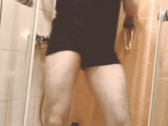 The man dances in the bathroom to the music