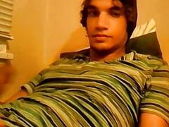 Young man tugs on his hard dick solo